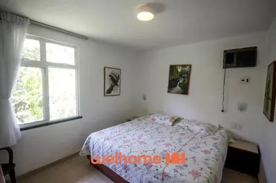 Uma cama ou camas num quarto em Casa em Guaramiranga com Piscina Coberta