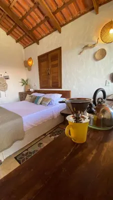 Uma cama ou camas num quarto em Preá Chalé Tsuru
