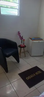 Uma área de estar em A Pousada Marcolino