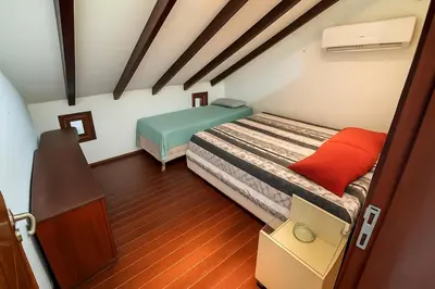 Uma cama ou camas num quarto em Taíba Beachfront Paradise - Cozy Apartment