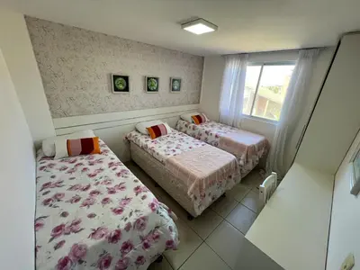Uma cama ou camas num quarto em Terramaris Frente Mar