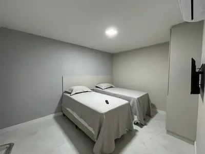 Uma cama ou camas num quarto em Atlântico Vista Mar