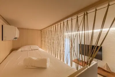 Uma cama ou camas num quarto em JG Flecheiras
