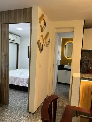 Uma cama ou camas num quarto em Flat Beira Mar - Fortaleza