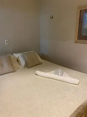 Uma cama ou camas num quarto em Casa de praia do pescador