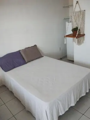 Uma cama ou camas num quarto em Pousada Brisa da Barra
