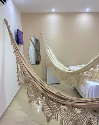 Uma cama ou camas num quarto em Suite no Centro da Praia de Flecheiras