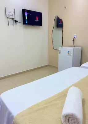 Uma cama ou camas num quarto em Suite no Centro da Praia de Flecheiras