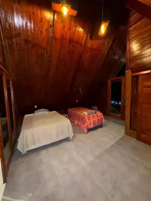 Uma cama ou camas num quarto em Cantinho Mulungú