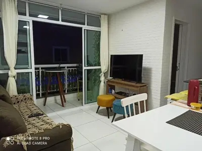 Uma televisão e/ou sistema de entretenimento em Apartamento Porto das dunas
