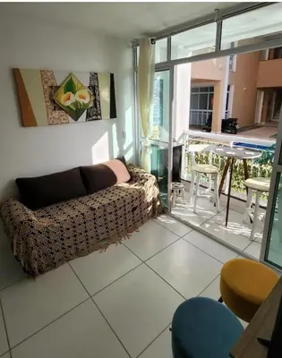 Uma área de estar em Apartamento Porto das dunas
