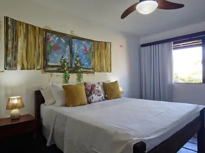 Uma cama ou camas num quarto em Mansao Santa Rita