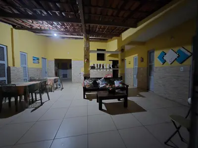 Uma televisão e/ou sistema de entretenimento em Pousada Virgínia