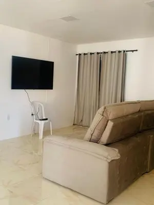 Uma televisão e/ou sistema de entretenimento em Casa Portal da Lagoinha