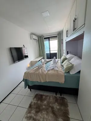 Uma cama ou camas num quarto em Apartamento vista mar no mucuripe