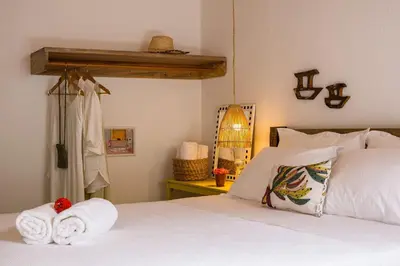 Uma cama ou camas num quarto em Casa Mangará