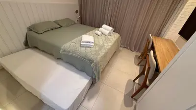 Uma cama ou camas num quarto em Estúdio a 200m da Beira-Mar-Beach Class Meireles