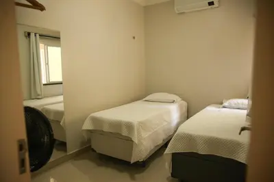 Uma cama ou camas num quarto em La Casa Lagoinha