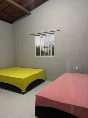 Uma cama ou camas num quarto em Chácara recanto do girassol