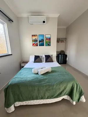 Uma cama ou camas num quarto em La Casa Lagoinha