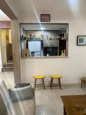 Uma área de estar em Casa boa vida