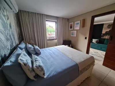 Uma cama ou camas num quarto em Kariri-Beautiful 1 bedroom flat, beachfront