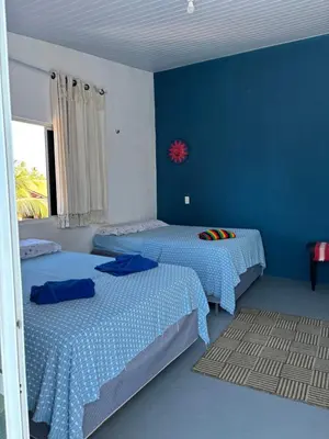 Uma cama ou camas num quarto em Casa Cochilo na Rede