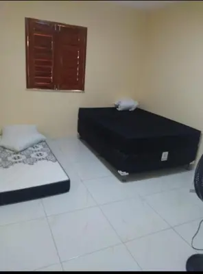 Uma cama ou camas num quarto em André Safadão Turismo