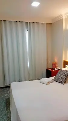 Uma cama ou camas num quarto em Flat tullip flores 706