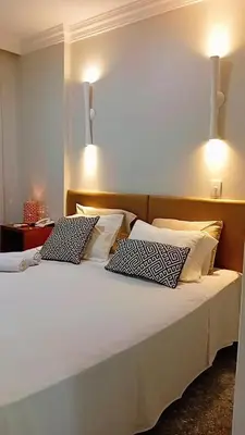 Uma cama ou camas num quarto em Flat tullip flores 706