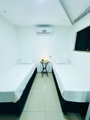 Uma cama ou camas num quarto em Happy Living Praia do Futuro
