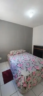 Uma cama ou camas num quarto em AP Bairro Araturi-Próximo a Praia do Icaraí Caucaia-CE