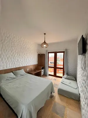 Uma cama ou camas num quarto em Aurora Beach