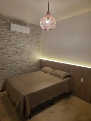Uma cama ou camas num quarto em Aurora Beach