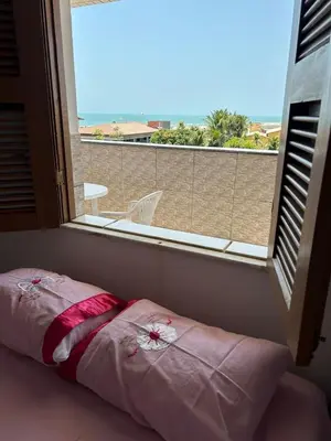 Uma cama ou camas num quarto em Family apartment near Beach Park