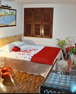 Uma cama ou camas num quarto em Pérolas Beach Hotel