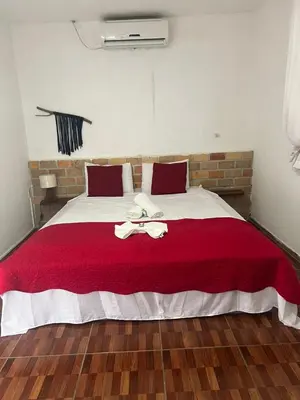 Uma cama ou camas num quarto em Pérolas Beach Hotel