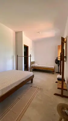 Uma cama ou camas num quarto em Casa da Tânia Preá