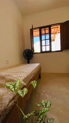 Uma cama ou camas num quarto em Casa da Tânia Preá