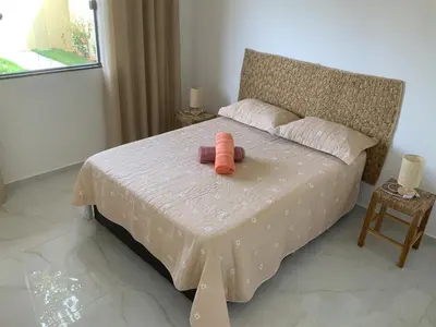 Uma cama ou camas num quarto em Casa dos cajueiros