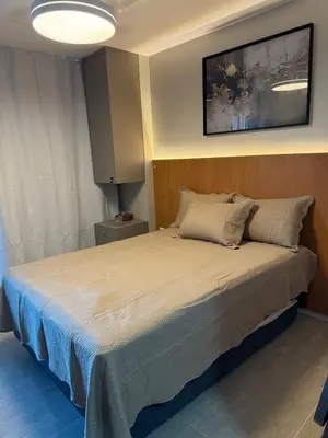 Uma cama ou camas num quarto em Apartamento em Fortaleza