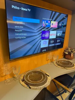 Uma televisão e/ou sistema de entretenimento em Apartamento em Fortaleza