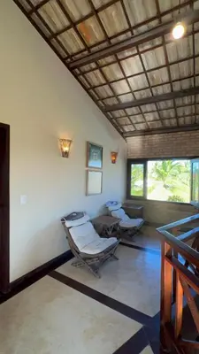 Uma área de estar em Casa Praia Uruau