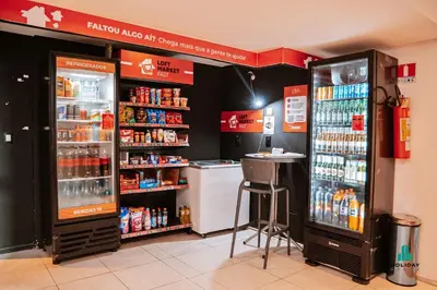 A área de bar ou lounge em Loft Praia by Holiday Stays