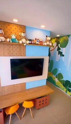 Uma televisão e/ou sistema de entretenimento em Apartamento aconchegante