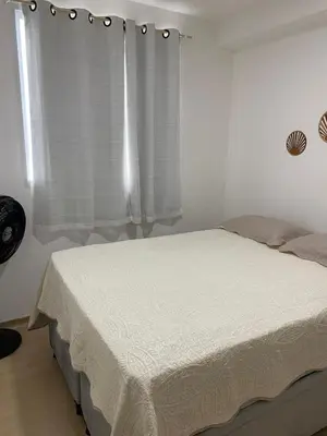 Uma cama ou camas num quarto em Apartamento aconchegante