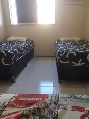 Uma cama ou camas num quarto em Apê Fortaleza Beira-Mar