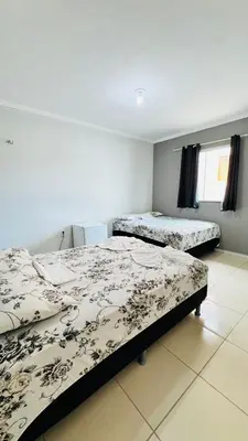 Uma cama ou camas num quarto em Flat Paulista 10