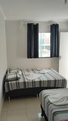 Uma cama ou camas num quarto em Flat Paulista 10