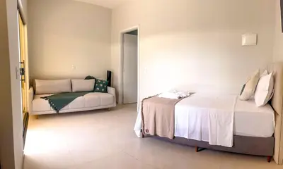 Uma cama ou camas num quarto em Pousada Beira dagua